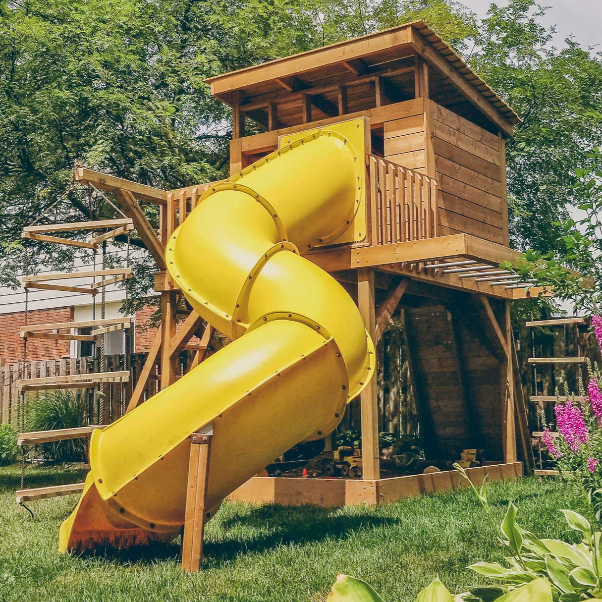 rear of sandbox monkey bars playset